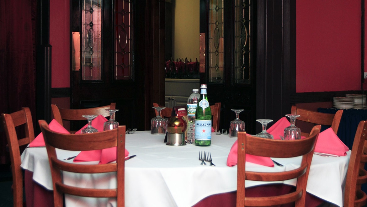 Tables laid with pink linen